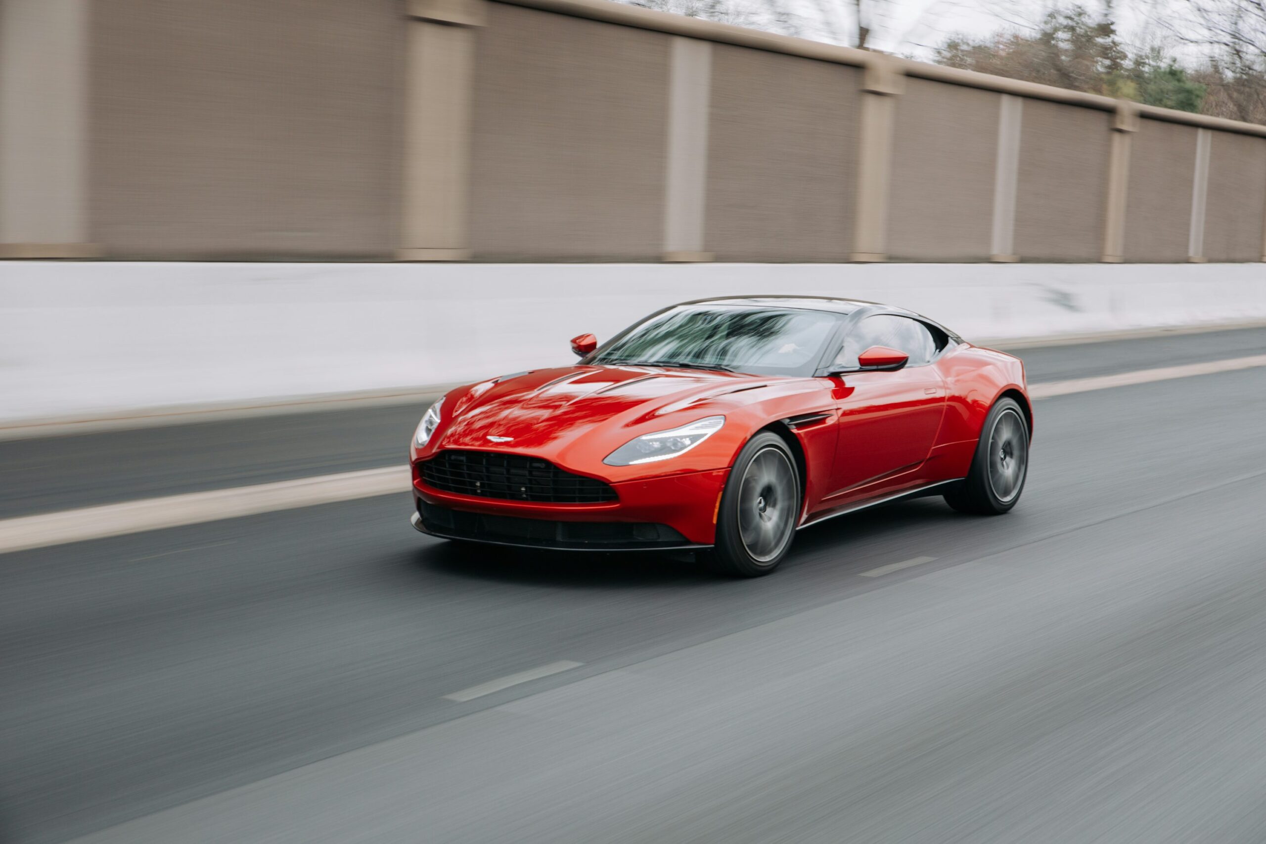 photo 1549927681 0b673b8243ab - Magvilla red coupe passing on road